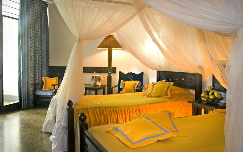 Cozy hotel room with canopy beds
