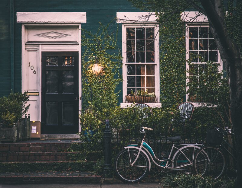 Cozy house with ivy and bicycle