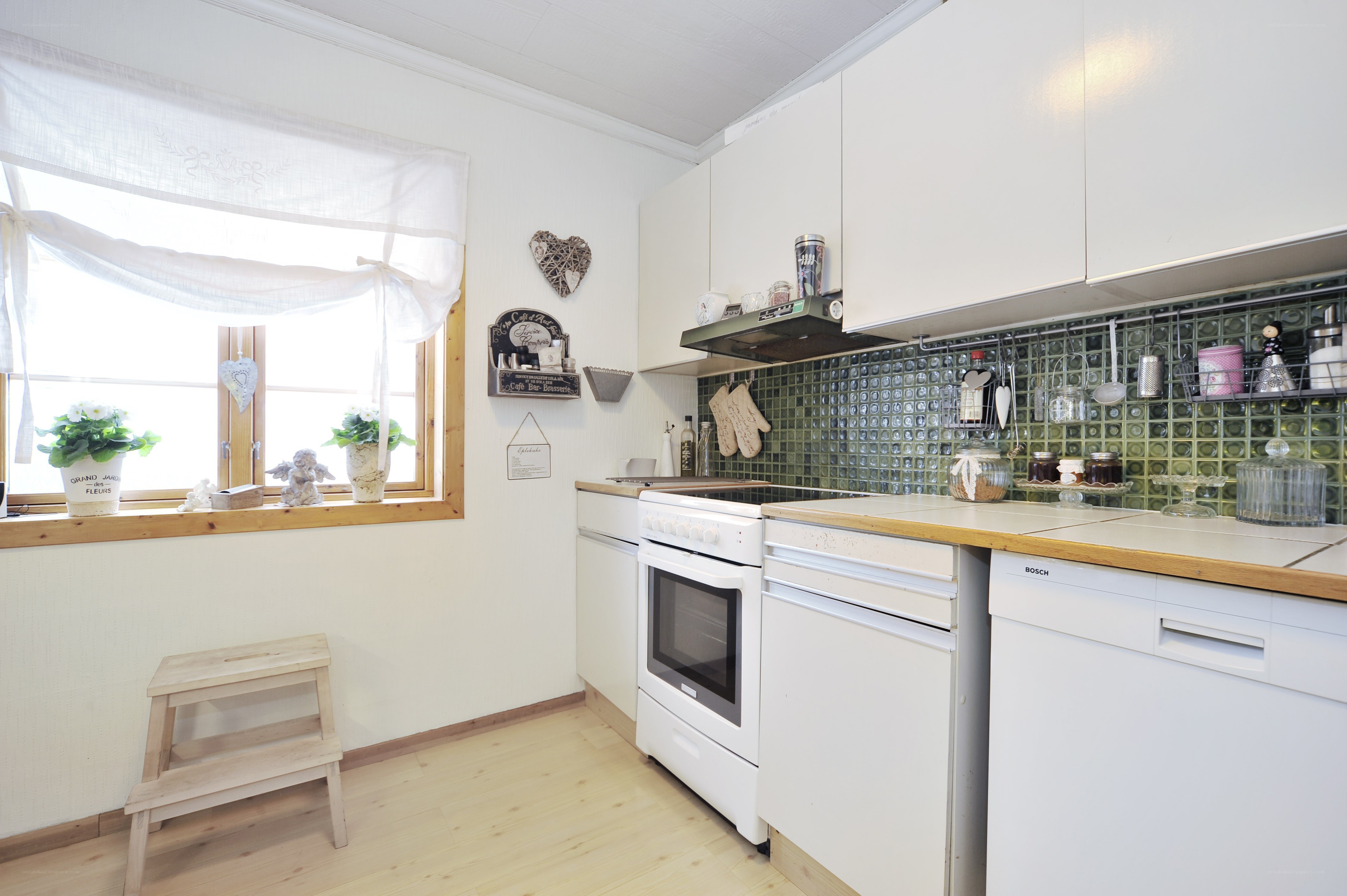 cozy kitchen with green tiles