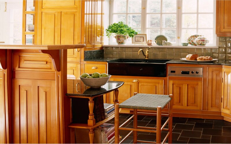 cozy kitchen with wooden cabinets