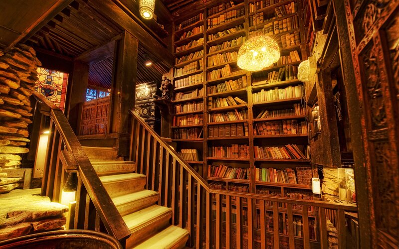 cozy library with wooden stairs