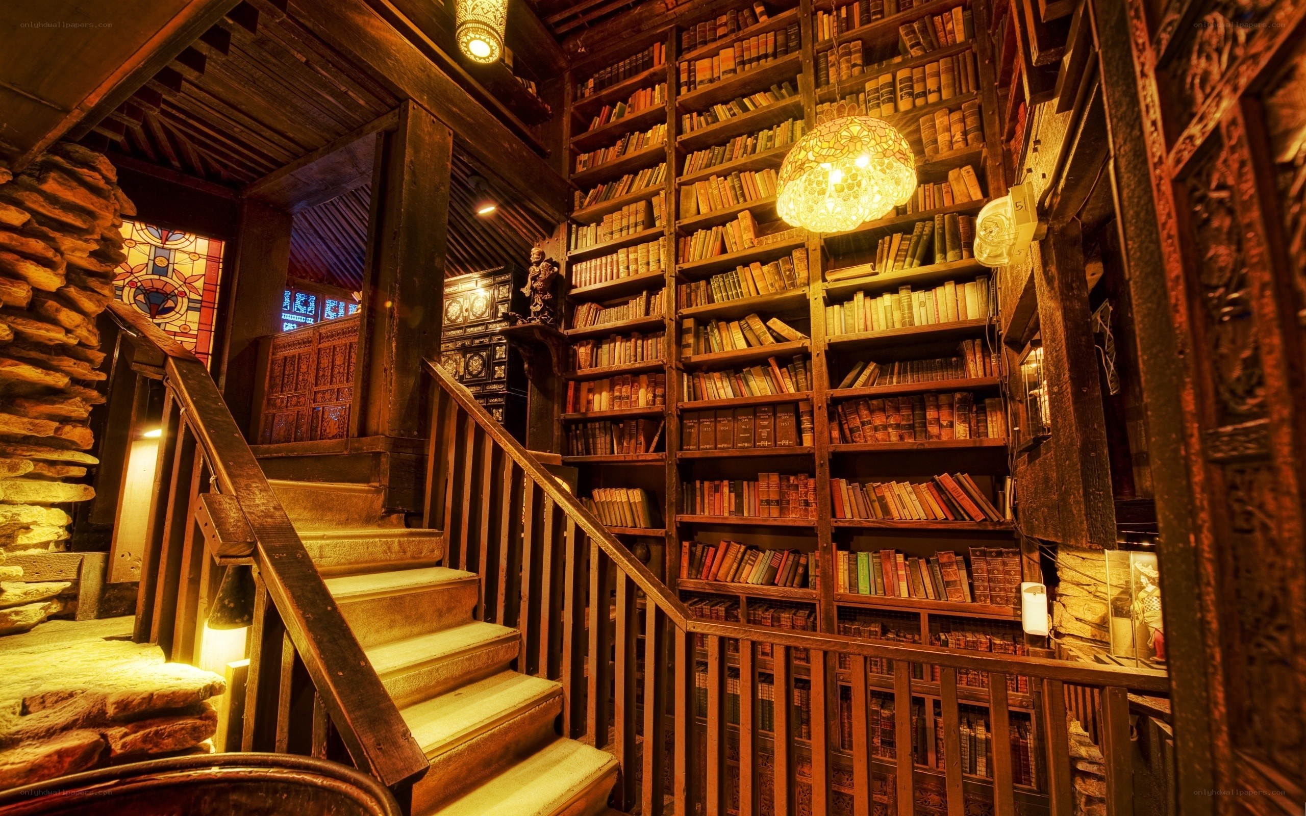 cozy library with wooden stairs