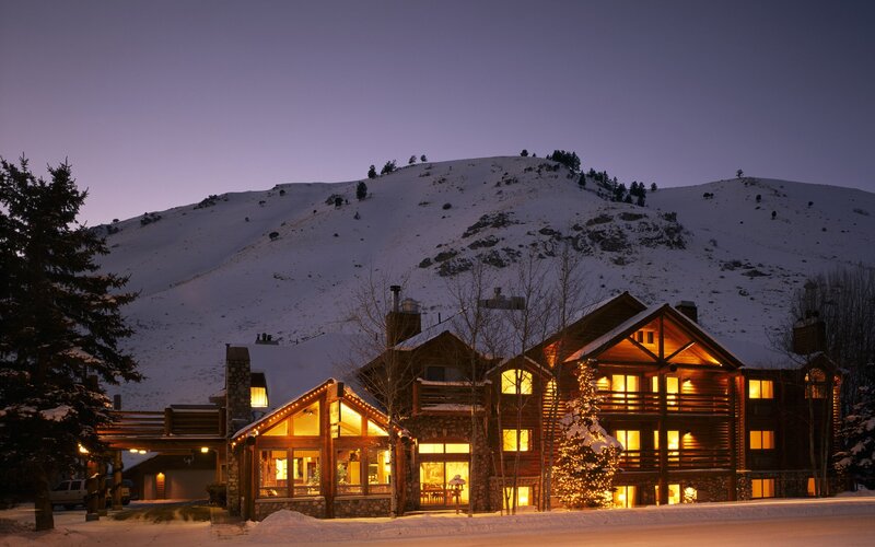 Cozy lodge at dusk in snowy mountains