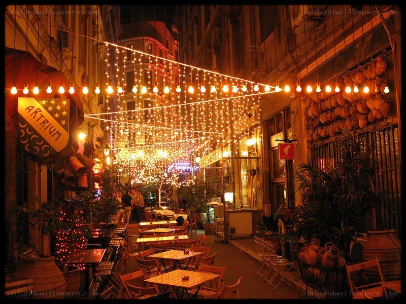 Cozy outdoor cafe at night