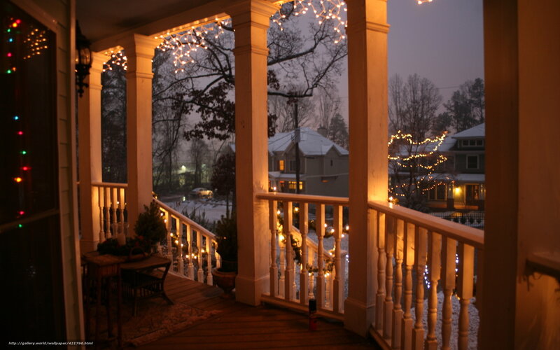 Cozy porch at dusk with lights