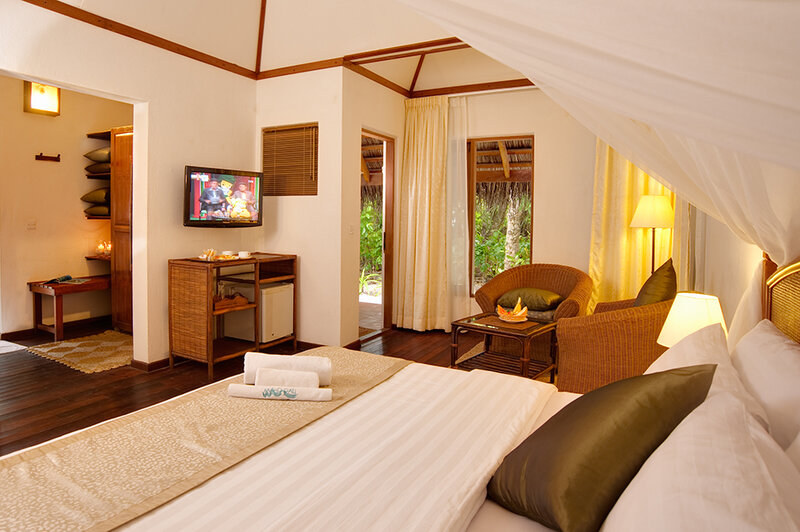 Cozy resort bedroom with canopy bed