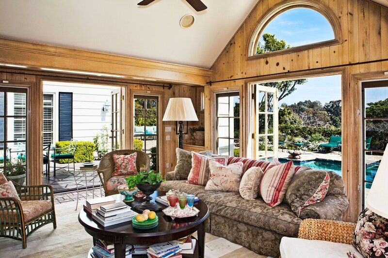Cozy sunroom with pool view