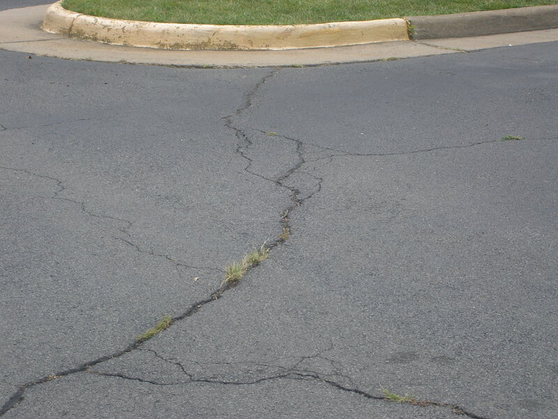 cracked asphalt road surface