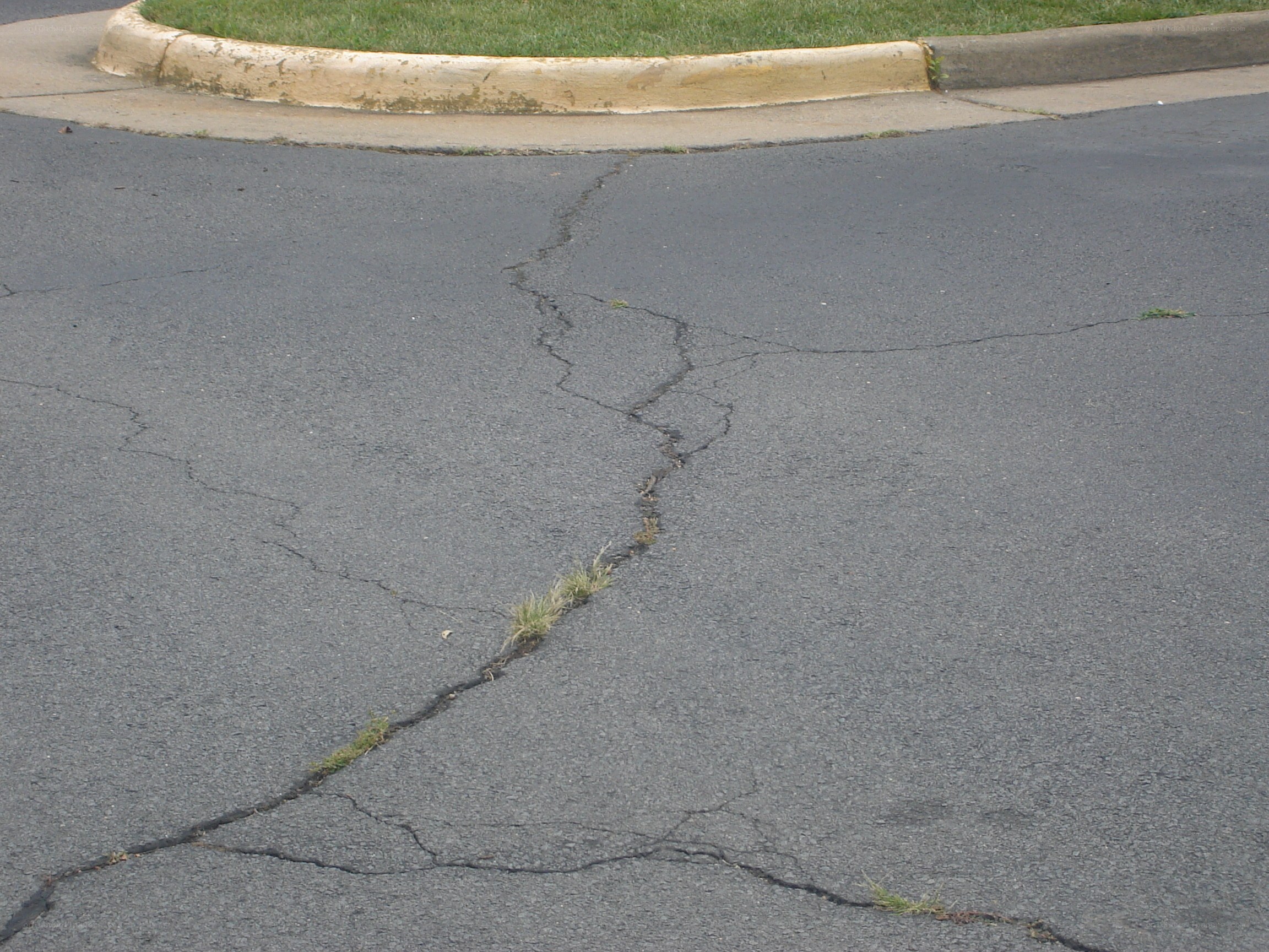 cracked asphalt road surface