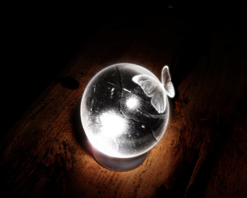 cracked crystal ball with butterfly