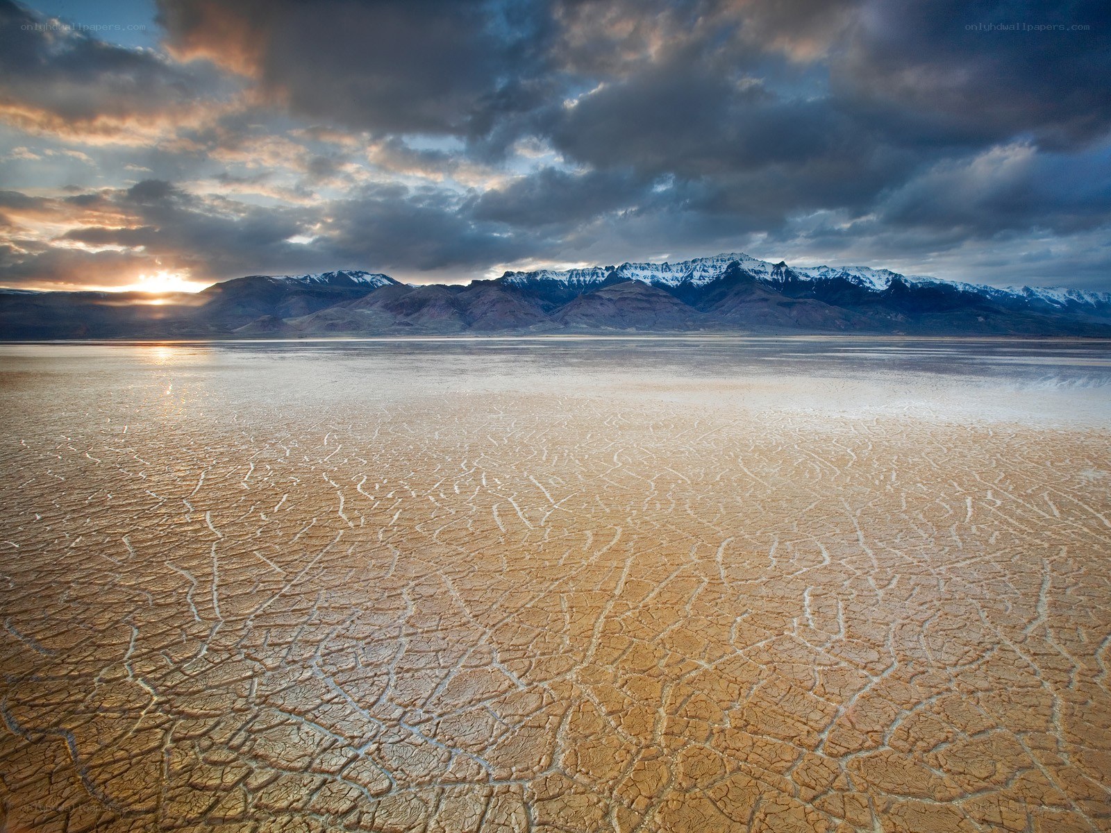 Cracked desert at sunset