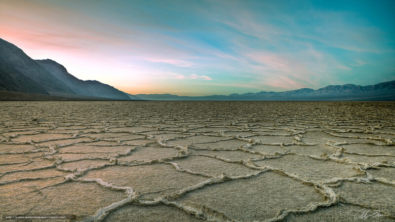 Cracked desert at sunset