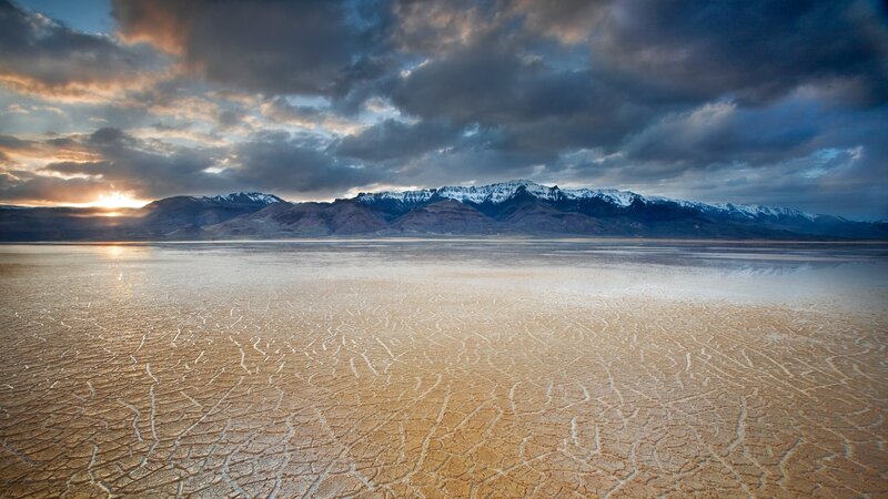 cracked desert with mountains