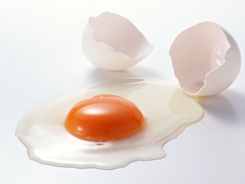 cracked egg on white surface