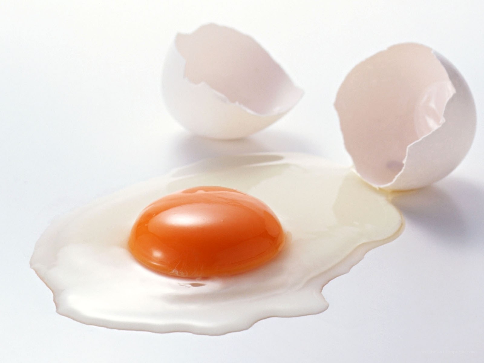 cracked egg on white surface