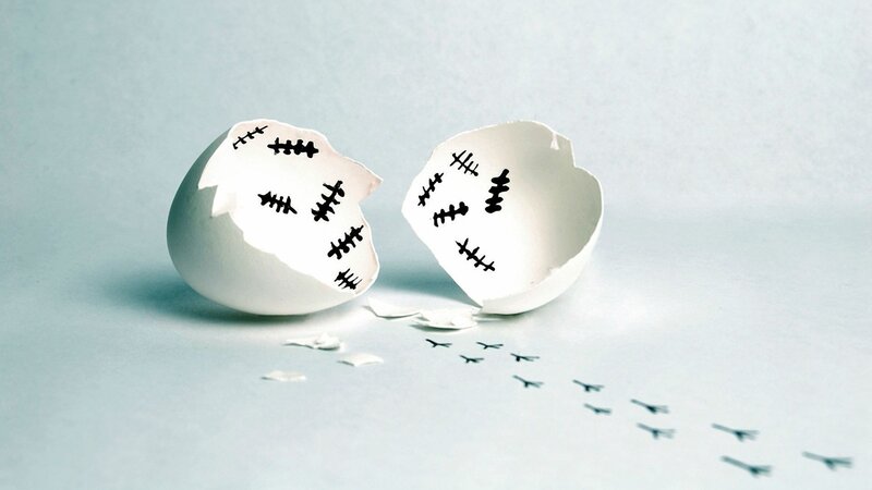 Cracked Eggshell with Stitches — White, Somber, Photograph, Footprints