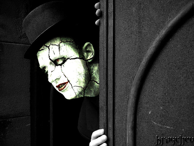 cracked face peeking from doorway