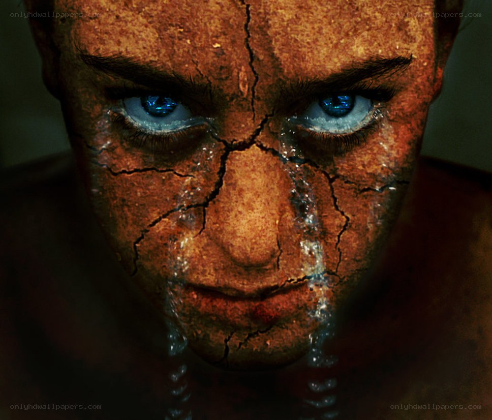 cracked face with blue eyes