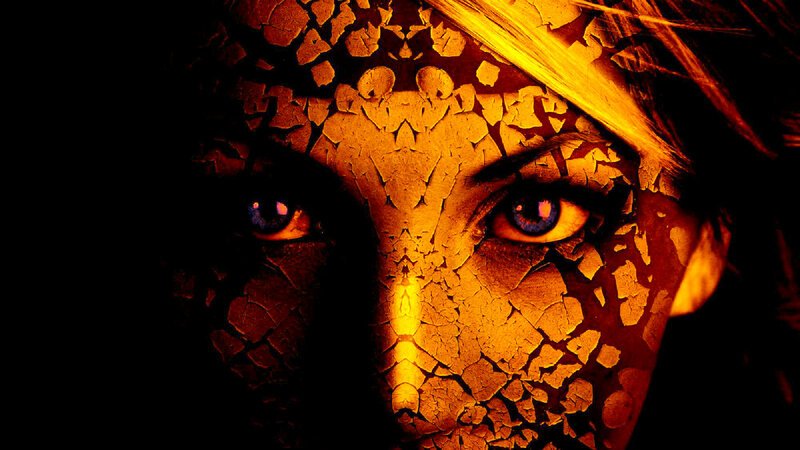 Cracked Face with Glowing Eyes — Orange