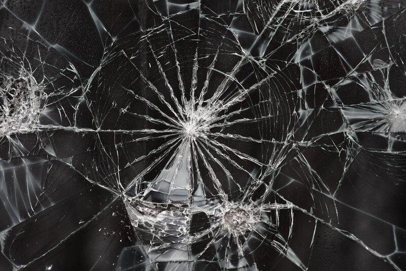 Cracked Glass Surface — Black, Dramatic, Photograph, Cracks, Shards, Impact Points