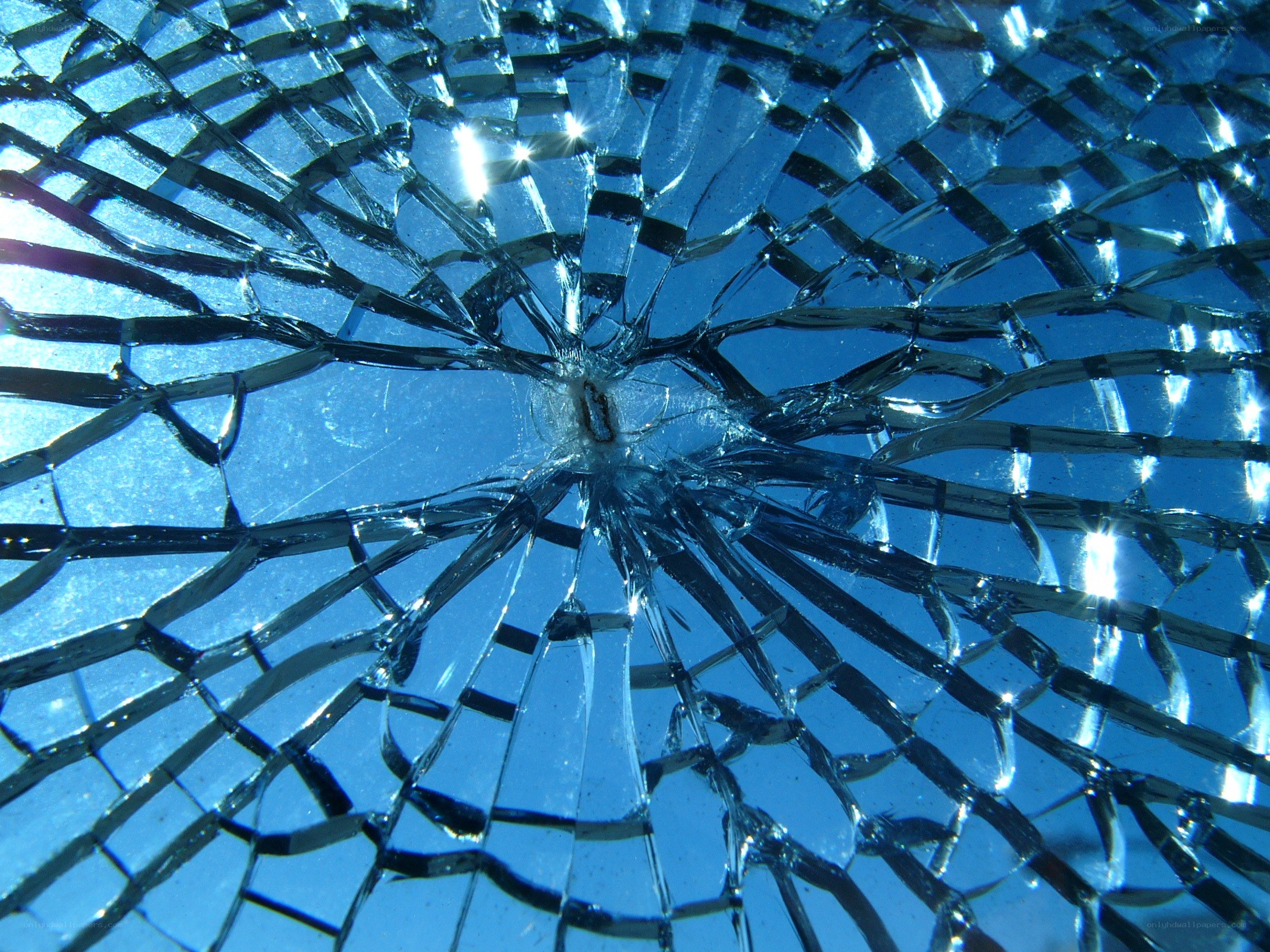 Cracked glass with blue sky