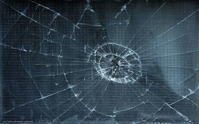 Cracked glass with bullet hole
