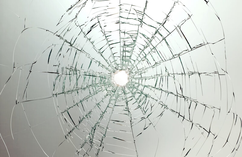 cracked glass with central hole
