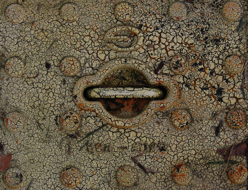 cracked metal surface with handle