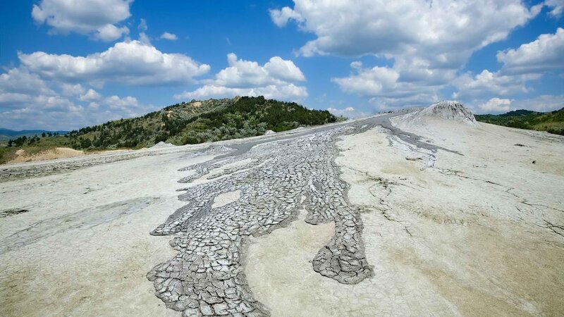 Cracked mud landscape under blue sky