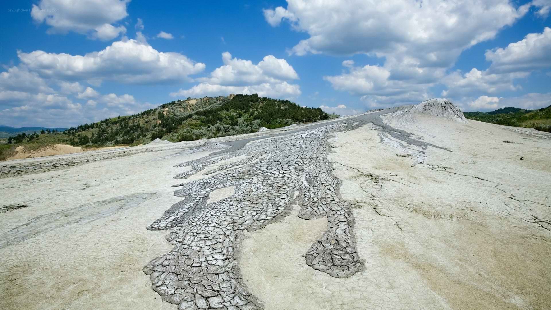 Cracked mud landscape under blue sky