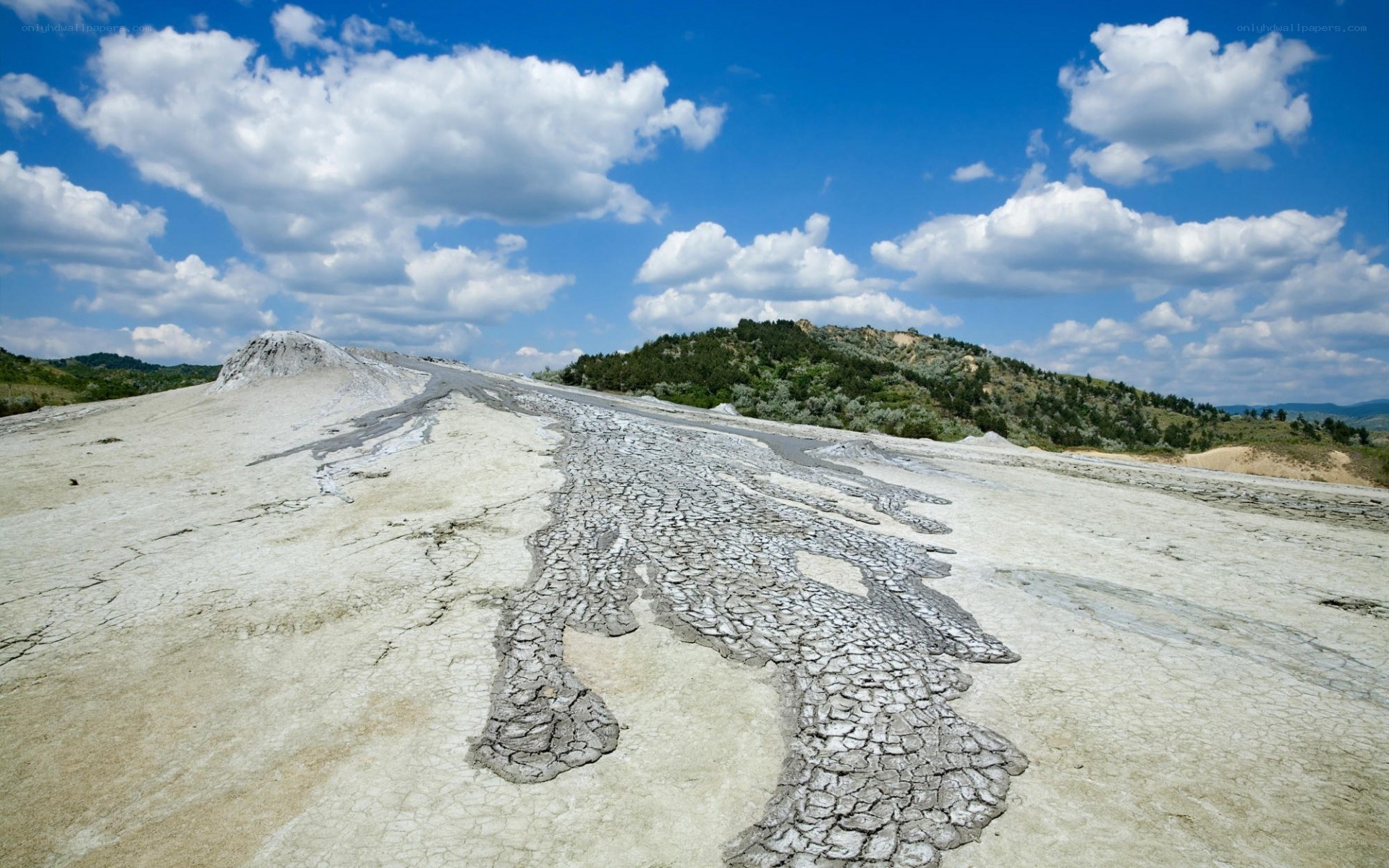 Cracked mud landscape under blue sky