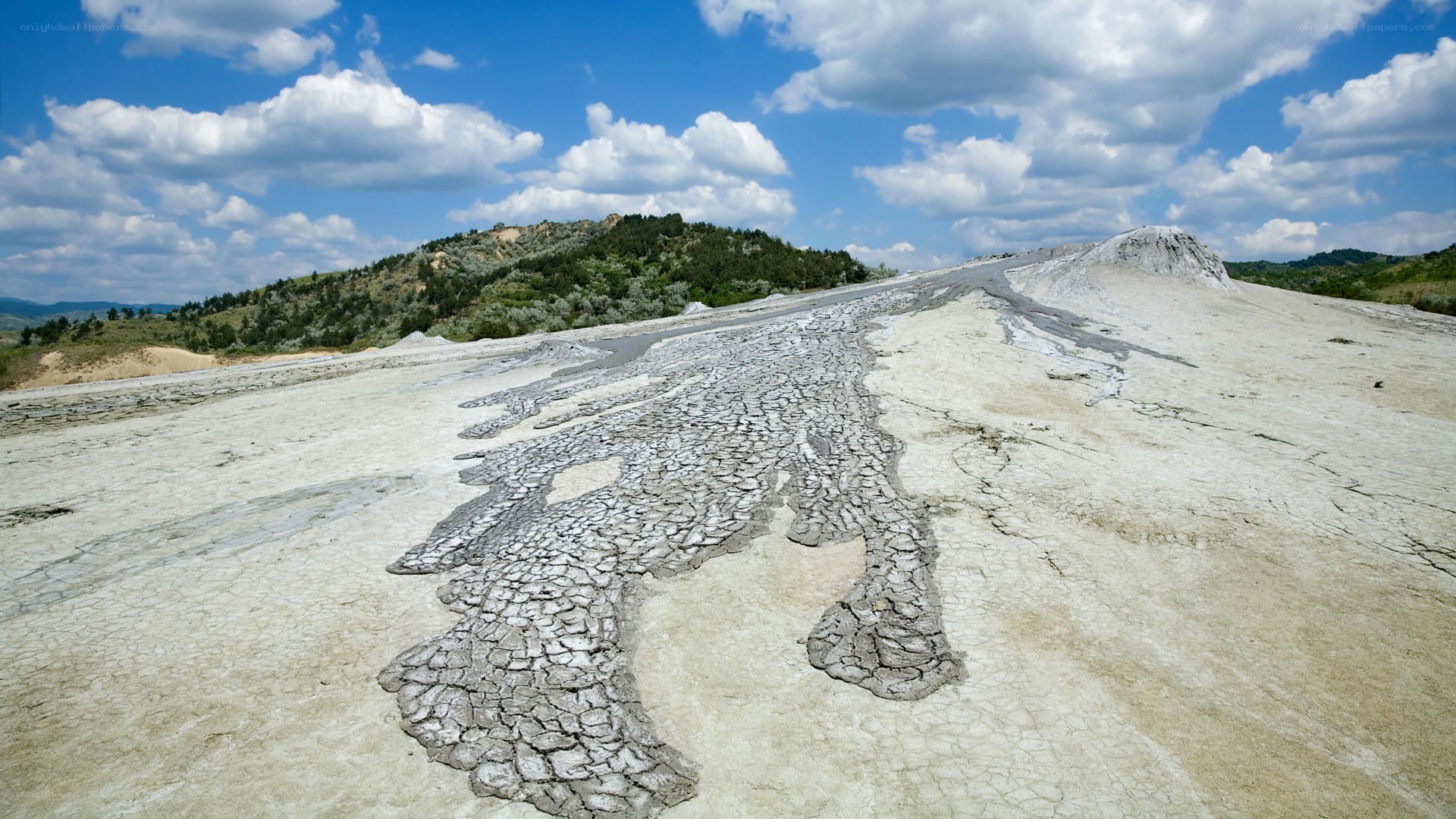 Cracked mud landscape under blue sky