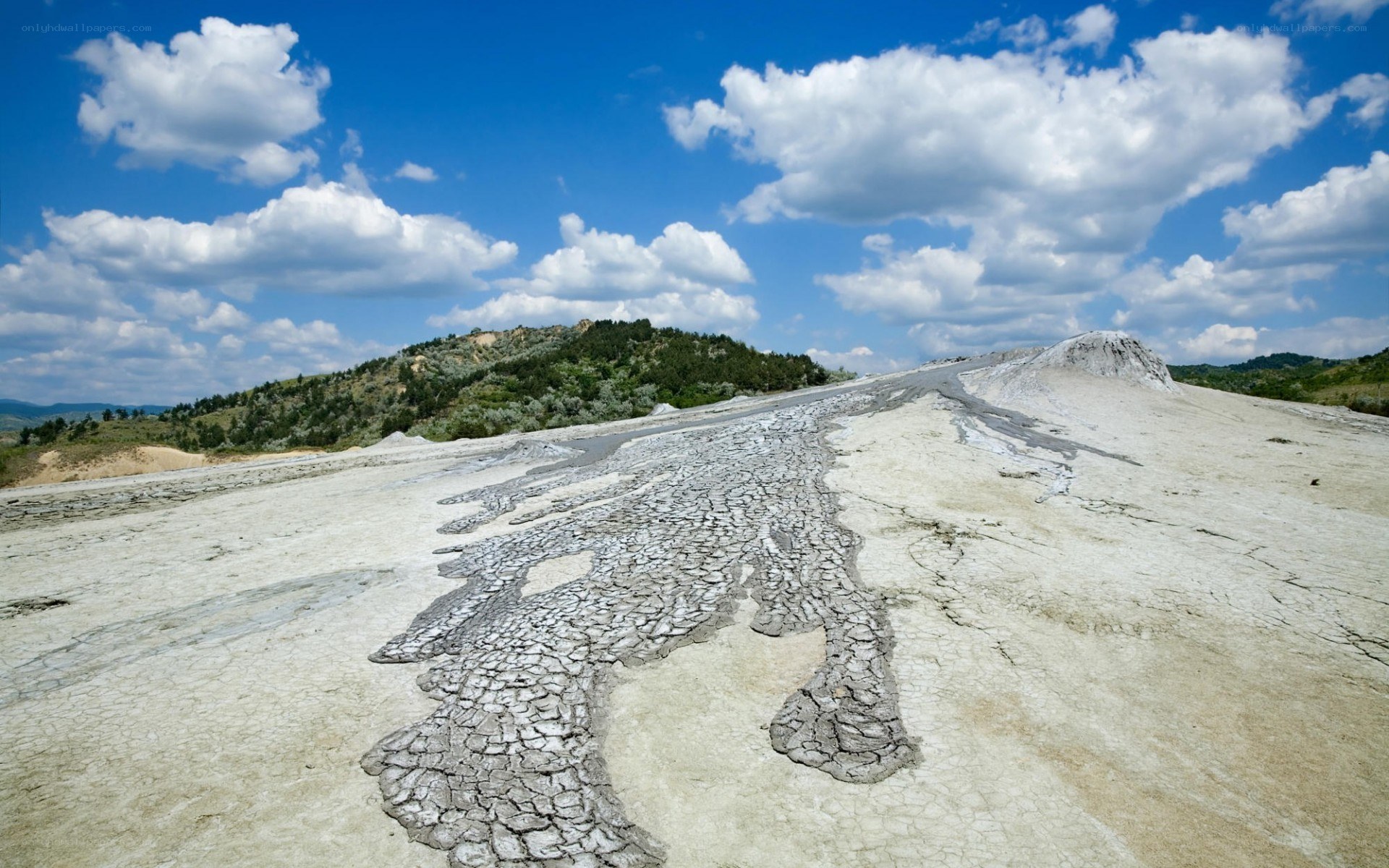 Cracked mud landscape under blue sky