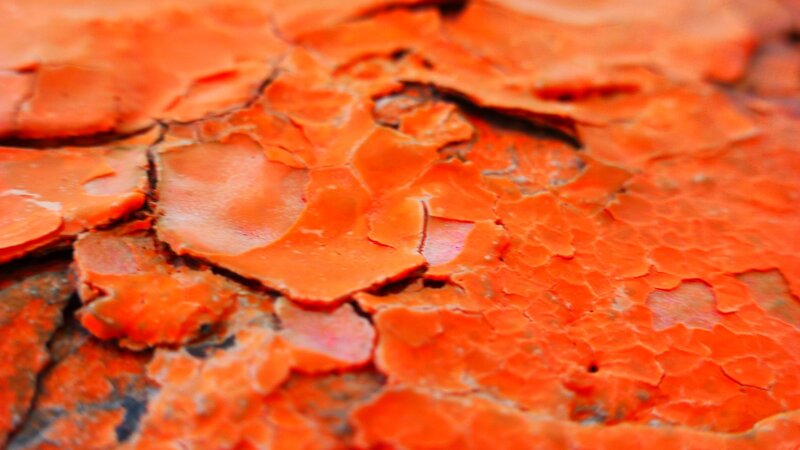 cracked orange paint surface