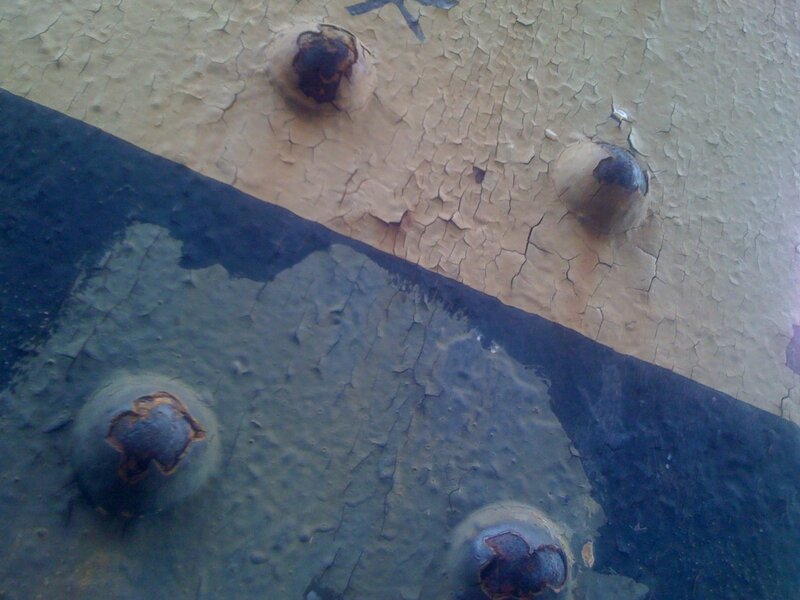 cracked paint and rivets