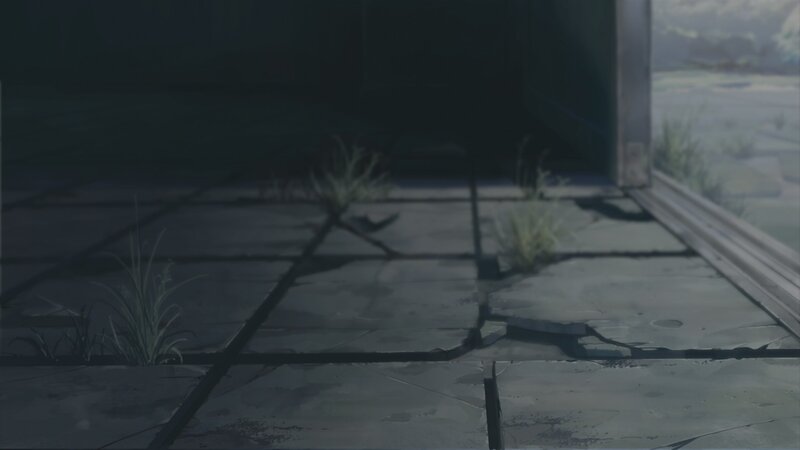 cracked pavement with weeds