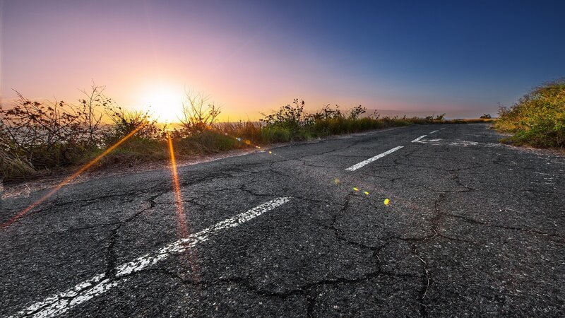 Cracked Road at Sunset — Blue