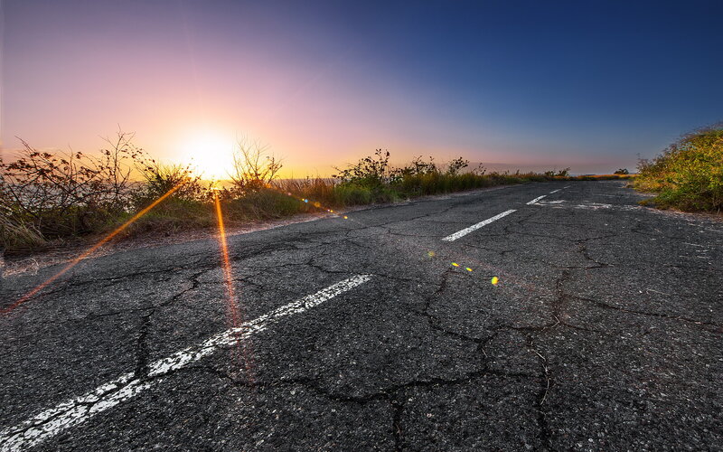 Cracked Road at Sunset