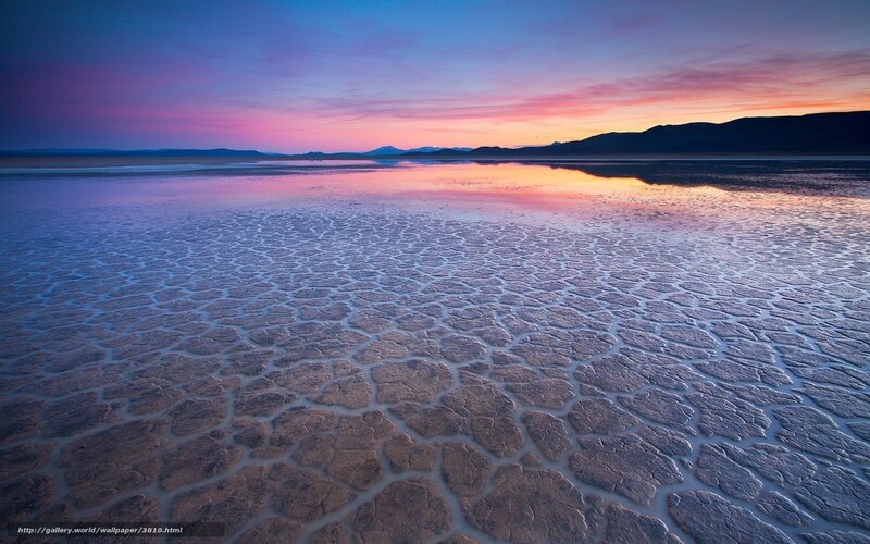 Cracked salt flat at sunset