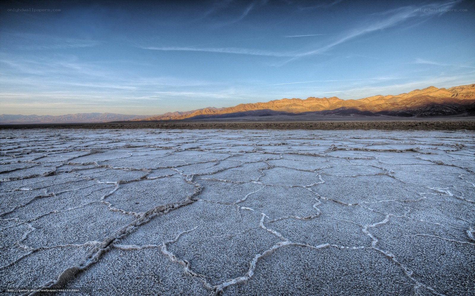 Cracked salt flats at sunset