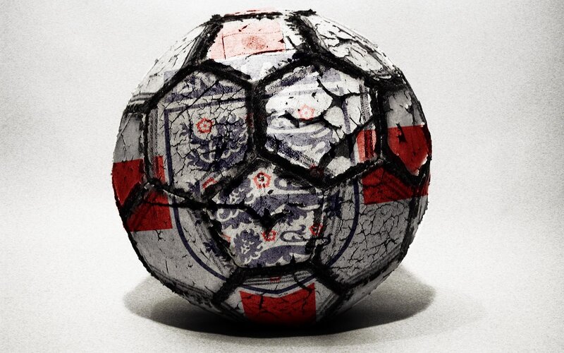 cracked soccer ball with flag design