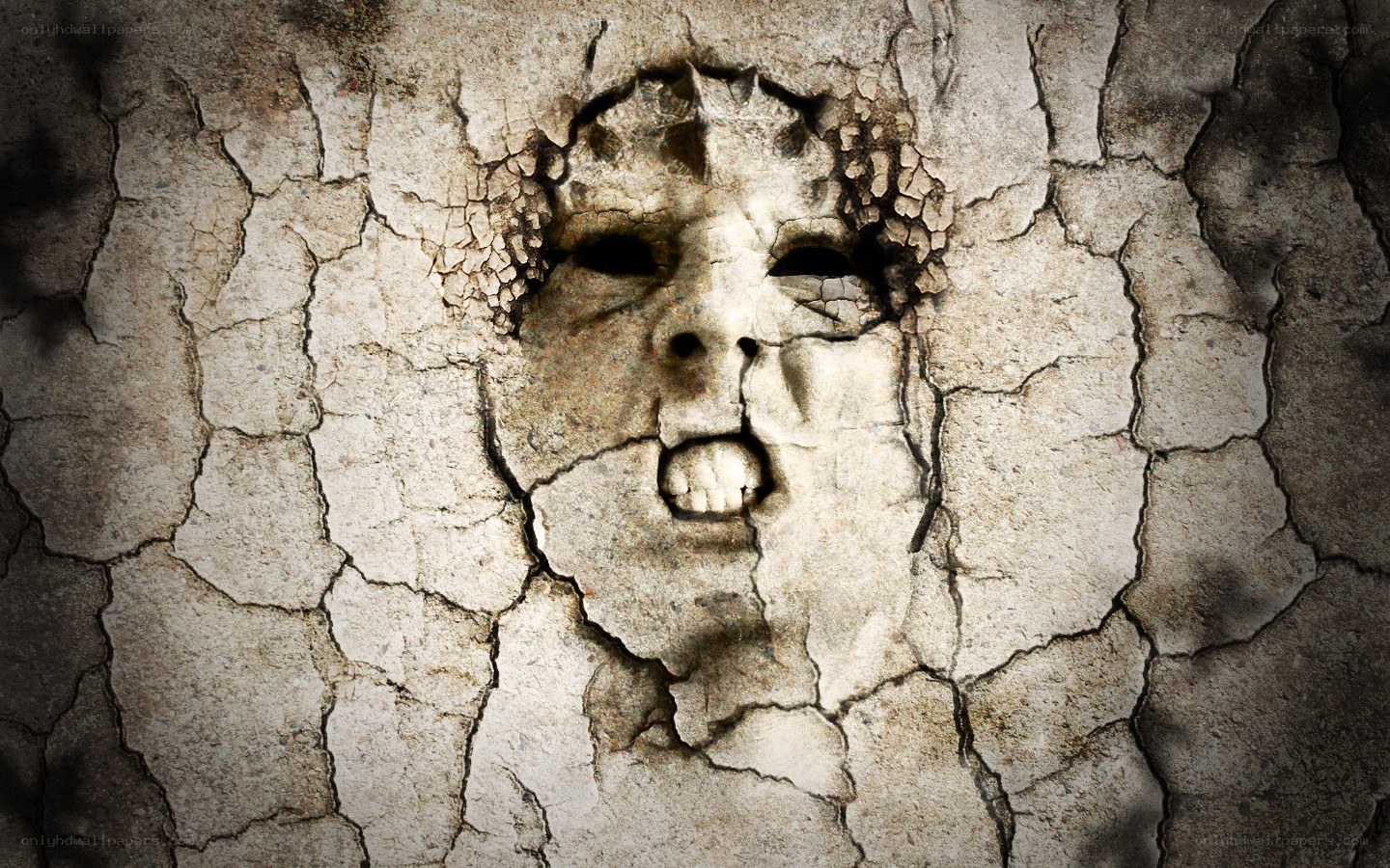 cracked stone face sculpture