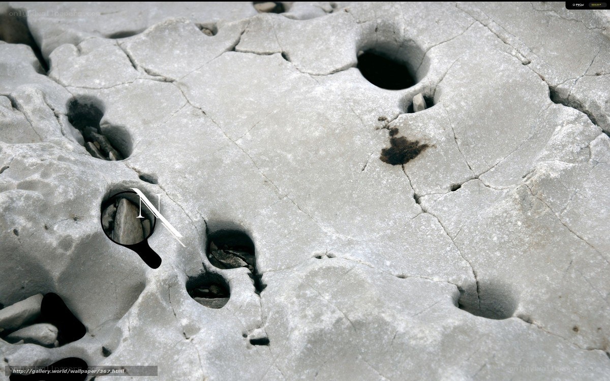 cracked stone surface with holes