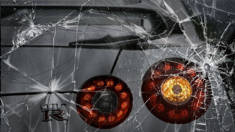cracked windshield with car lights