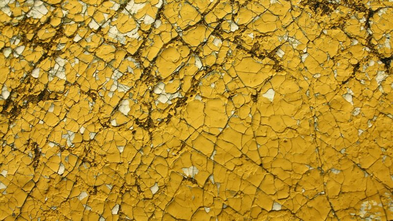 cracked yellow paint surface