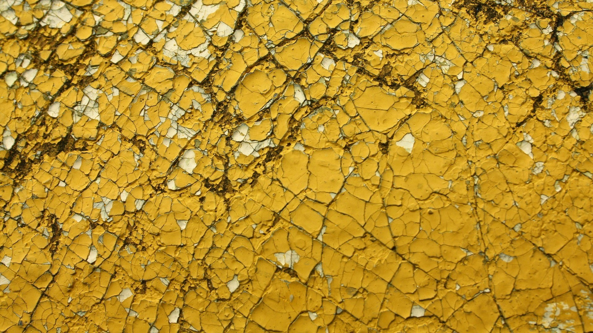 cracked yellow paint surface