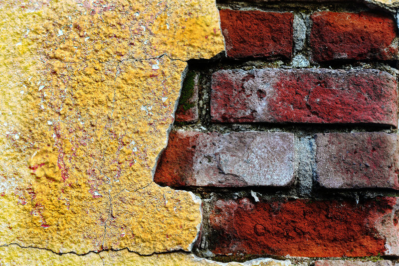 Cracked Yellow Plaster Wall