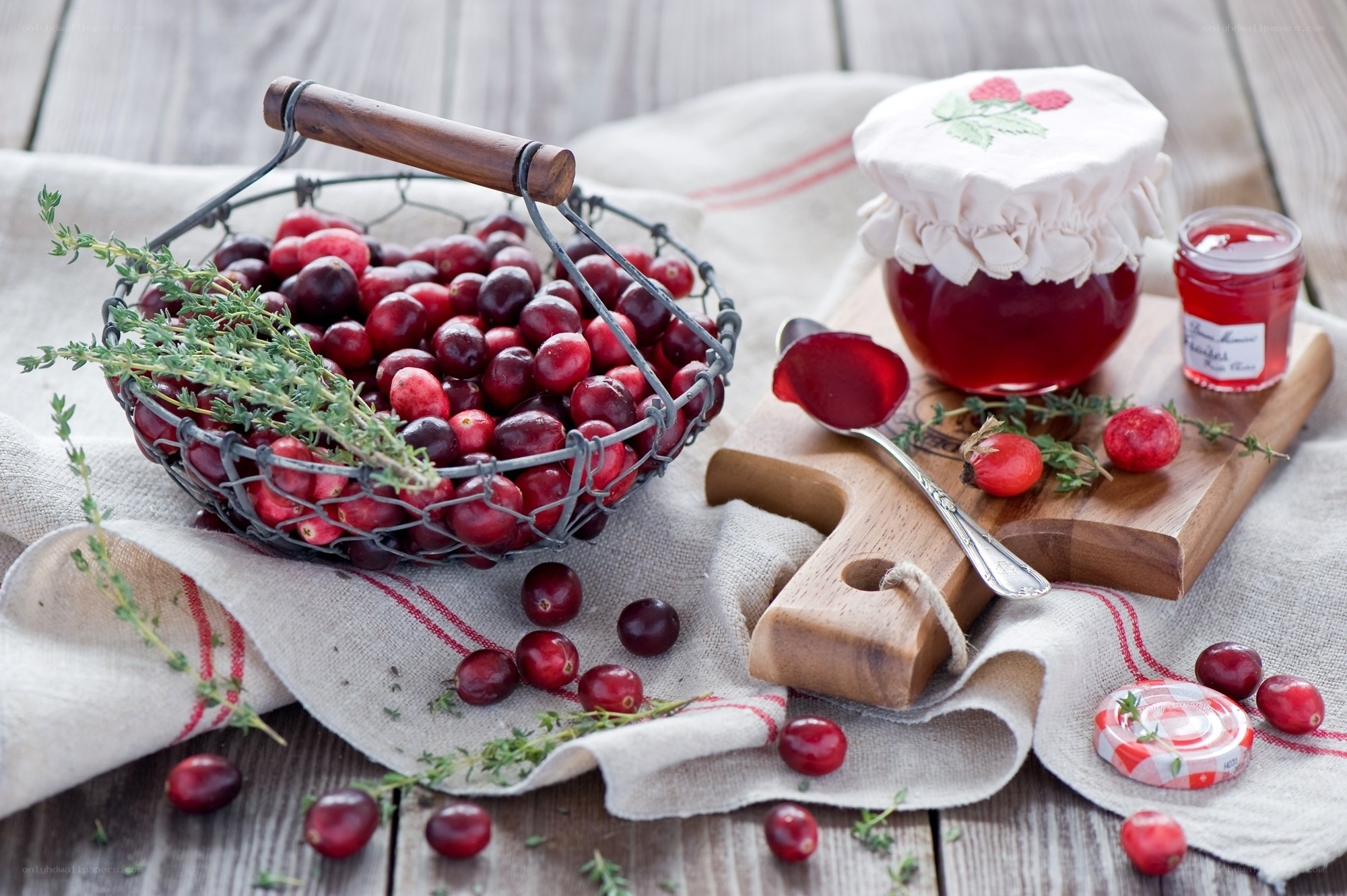 Cranberries and jam on wood