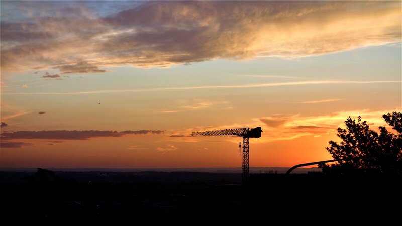 Crane at Sunset — Orange, Dramatic
