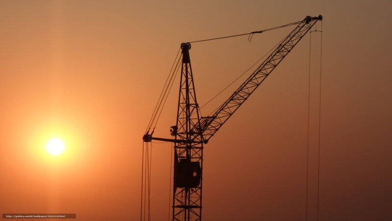 Crane at sunset silhouette